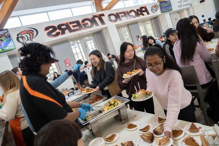 students enjoy thanksgiving meal